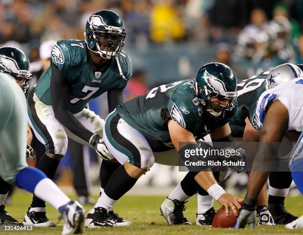 Michael Vick of the Philadelphia Eagles lines up under center Jason Kelce against the Dallas Cowboys during a game at Lincoln Financial Field on...