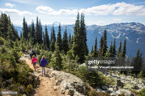 single mother hiking with daughters in moutnains. - blackcomb mountain stock pictures, royalty-free photos & images