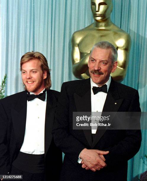 Kiefer Sutherland and his father Donald Sutherland backstage at the 61st Annual Academy Awards Show, March 29, 1989 in Los Angeles, California.
