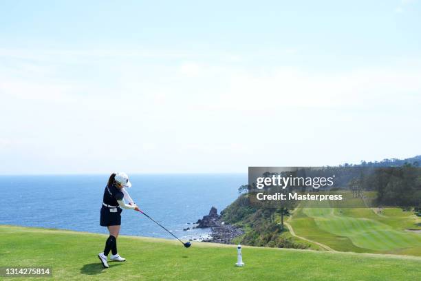 Ayaka Furue of Japan hits her tee shot on the 16th hole during the final round of the Fuji Sankei Ladies Classic at the Kawana Hotel Golf Course Fuji...