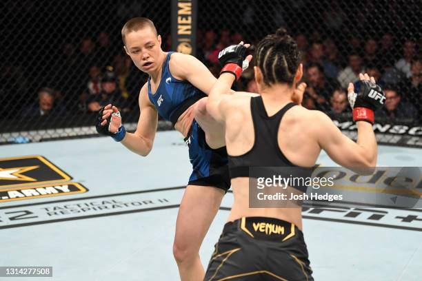Rose Namajunas kicks Zhang Weili of China in their UFC women's strawweight championship bout during the UFC 261 event at VyStar Veterans Memorial...