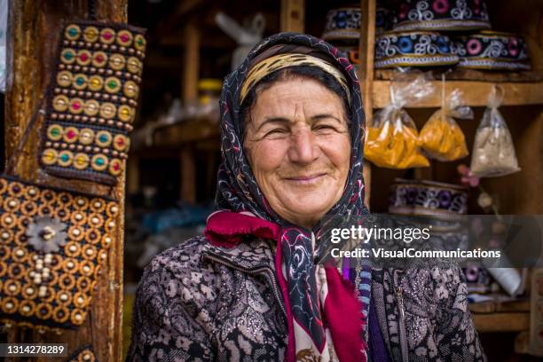 portrait of lahic local woman selling souvernirs. - caucasus stock pictures, royalty-free photos & images