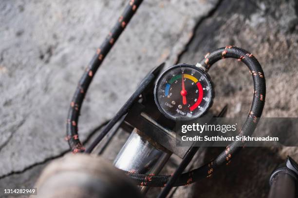 high angle view of bicycle pump gauge - bicycle pump stock pictures, royalty-free photos & images