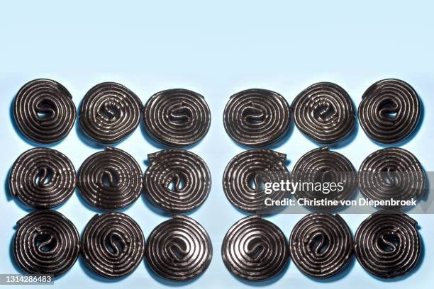 assorted licorice on plain background - drop stockfoto's en -beelden