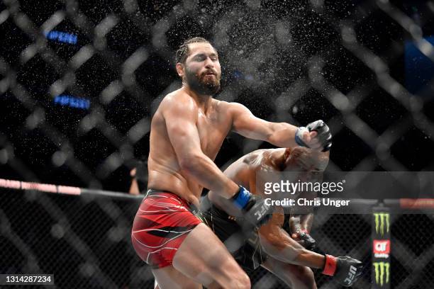 Kamaru Usman of Nigeria punches Jorge Masvidal in their UFC welterweight championship bout during the UFC 261 event at VyStar Veterans Memorial Arena...