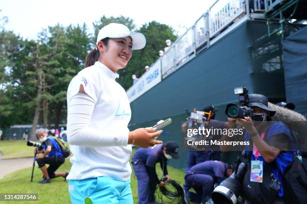 Mone Inami of Japan smiles after winning the tournament following the final round of the Fuji Sankei Ladies Classic at the Kawana Hotel Golf Course...