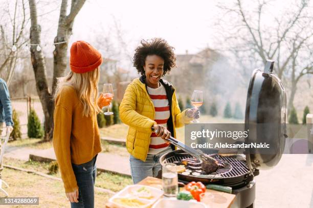 preparing a classic july 4th barbecue with my bestie - 4th of july with wine stock pictures, royalty-free photos & images