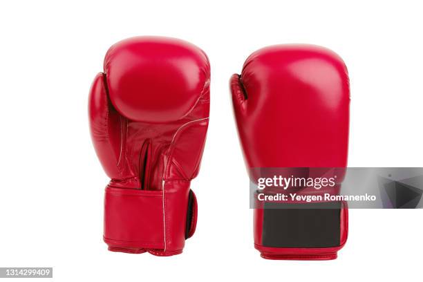 pair of red leather boxing gloves isolated on white background - red glove stock-fotos und bilder