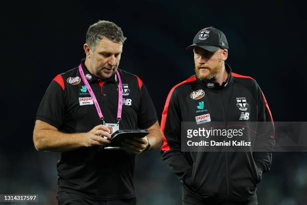 Brendon Lade, assistant coach of the Saints and Jarryd Roughead, Saints head of operations look on during the round six AFL match between the Port...