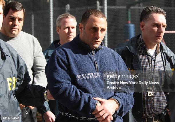 Perp walk members of the Gambino crime family Mario Cassarino and William Scotto walking out of Federal Plaza.