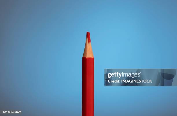 red pencil highlighting on a blue background - red pen single object stock pictures, royalty-free photos & images