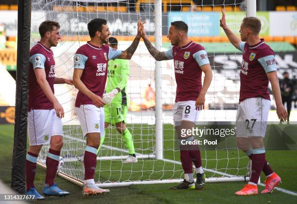 Chris Wood of Burnley celebrates with teammates Dwight McNeil, Josh Brownhill and Matej Vydra after scoring their team's second goal during the...