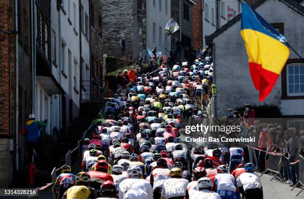 The Peloton passing through Côte de Saint-Roch in Houffalize City during the 107th Liege - Bastogne - Liege 2021, Men's Elite a 259,5km race from...