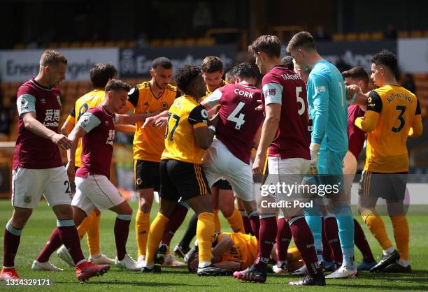 Adama Traore of Wolverhampton Wanderers clashes with Jack Cork of Burnley during the Premier League match between Wolverhampton Wanderers and Burnley...