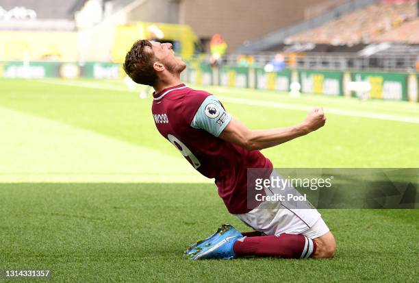 Chris Wood of Burnley celebrates after scoring their side's third goal and his hat trick during the Premier League match between Wolverhampton...