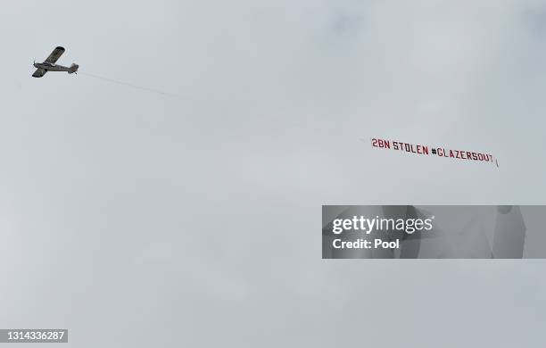 Plane with a banner that reads "2bn Stolen Glazers Out" on is flown over the ground prior to the Premier League match between Leeds United and...