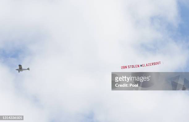 Plane with a banner that reads "2bn Stolen Glazers Out" on is flown over the ground prior to the Premier League match between Leeds United and...