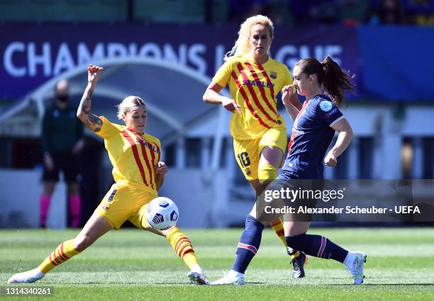 Maria Leon of FC Barcelona and Sara Dabritz of Paris Saint-Germain battle for possession during the UEFA Women's Champions League semi final match...