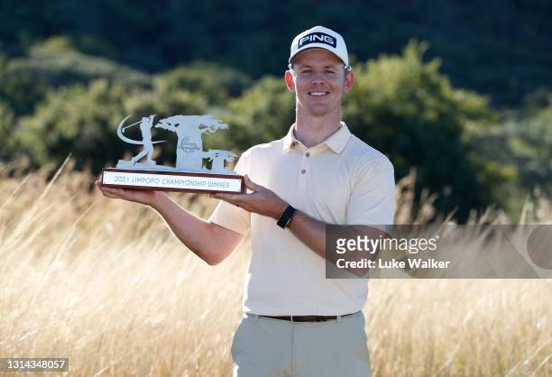 Brandon Stone of South Africa poses with the trophy after winning the Limpopo Championship at Euphoria Golf Club, Modimolle on April 25, 2021 in...