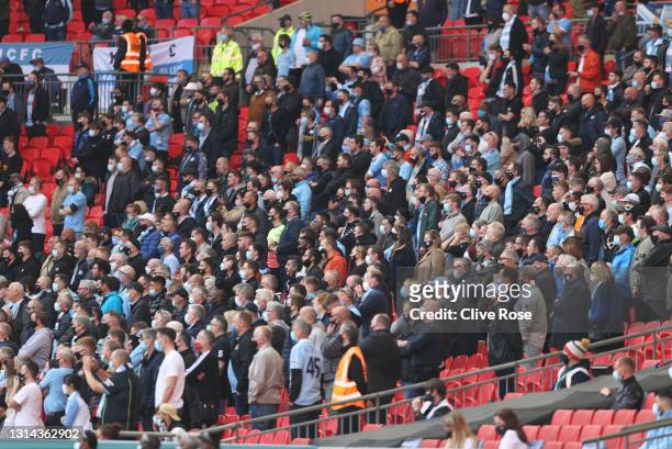 Manchester City fans watch the game from the stands during the Carabao Cup Final between Manchester City and Tottenham Hotspur at Wembley Stadium on...
