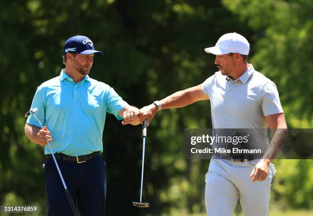 Brice Garnett and Scott Stallings react to a putt on the second green during the final round of the Zurich Classic of New Orleans at TPC Louisiana on...