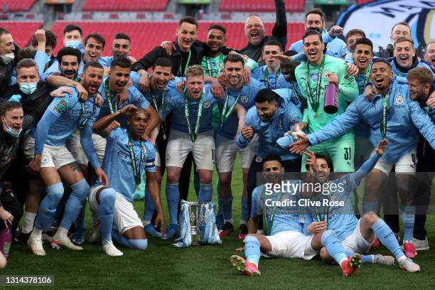 Players of Manchester City celebrate with the trophy after winning the Carabao Cup after the Carabao Cup Final between Manchester City and Tottenham...