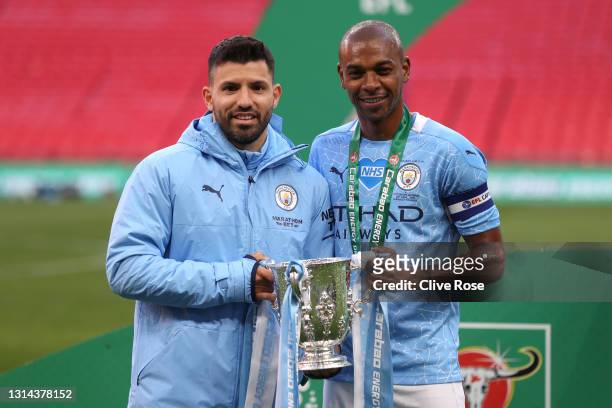 Sergio Aguero and Fernandinho of Manchester City celebrates with the trophy after winning the Carabao Cup after the Carabao Cup Final between...
