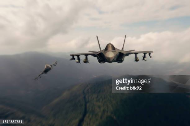 f-35 lightning ii aircrafts flying over mountains. - air force operations stock pictures, royalty-free photos & images