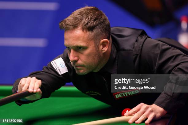 Jamie Jones of Wales plays a shot during the Betfred World Snooker Championship Round Two match between Jamie Jones of Wales and Stuart Bingham of...