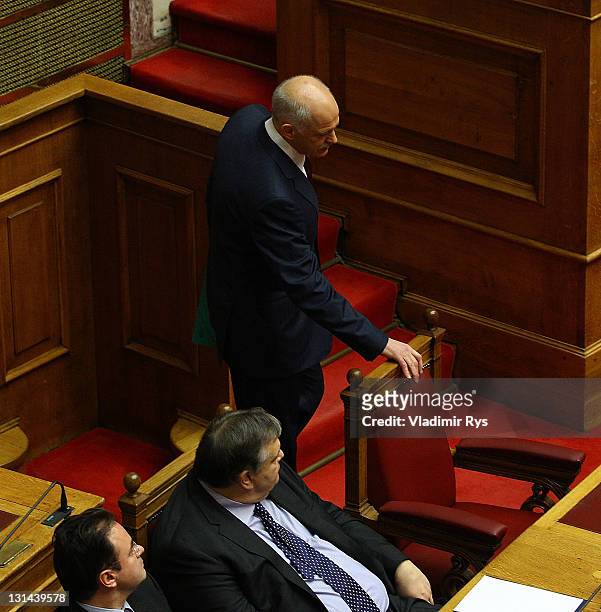 Greek Prime Minister George Papandreou stands beside Finance Minister Evangelos Venizelos ahead of his speech and the confidence vote in his...