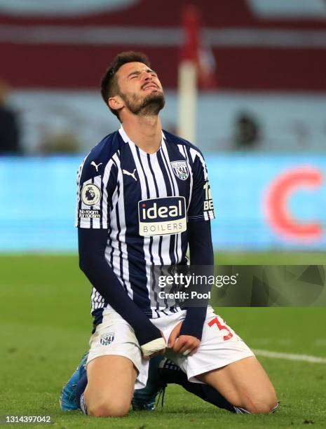 Okay Yokuslu of West Bromwich Albion looks dejected after Keinan Davis scores Aston Villa's second goal during the Premier League match between Aston...