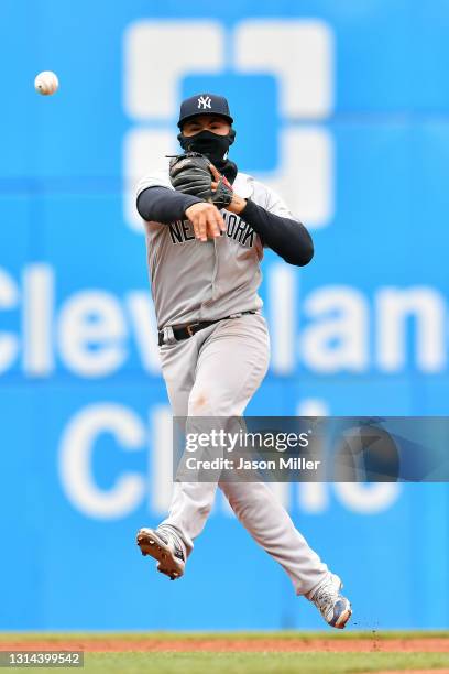 Shortstop Gleyber Torres of the New York Yankees throws out Josh Naylor of the Cleveland Indians at first during the fourth inning at Progressive...