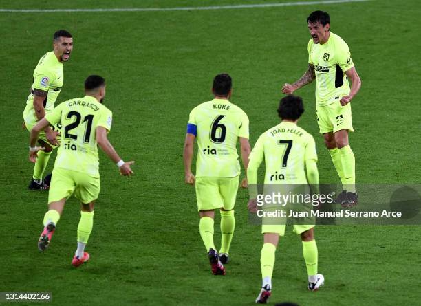 Stefan Savic of Atletico de Madrid celebrates with team mates after scoring their side's first goal during the La Liga Santander match between...