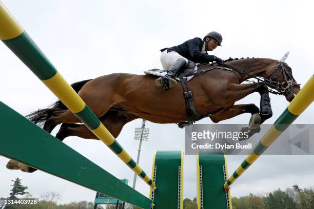 Phillip Dutton atop Fernhill Singapore competes during the Stadium Jumping Phase of the Land Rover Kentucky Three-Day Event at the Kentucky Horse...