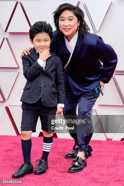 Alan S. Kim and Christina Oh attend the 93rd Annual Academy Awards at Union Station on April 25, 2021 in Los Angeles, California.
