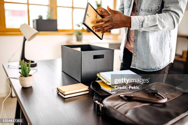 taking stuff out of box for setting up new home office - employee being fired stock pictures, royalty-free photos & images