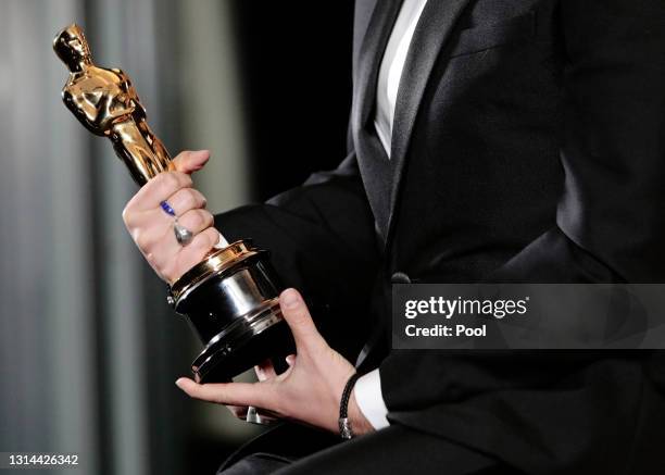 Florian Zeller poses with his Oscars statuette after winning the Best Adapted Screenplay for the 'The Father' at a screening of the Oscars on Monday...