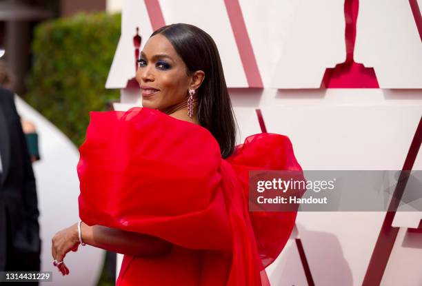 In this handout photo provided by A.M.P.A.S., Angela Bassett attends the 93rd Annual Academy Awards at Union Station on April 25, 2021 in Los...