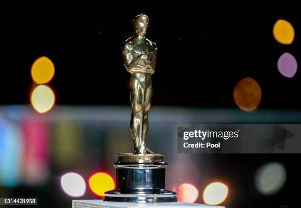 An Oscar statue is seen during a screening of the Oscars on April 26, 2021 in Paris, France.