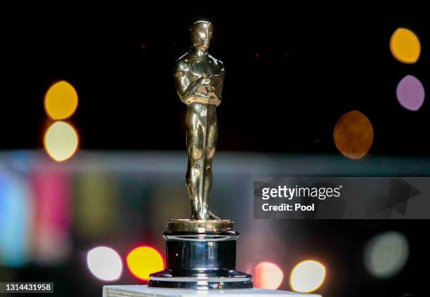 An Oscar statue is seen during a screening of the Oscars on April 26, 2021 in Paris, France.