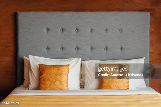 cozy bedroom with comfortable bed in modern studio apartment. - headboard ストックフォトと画像