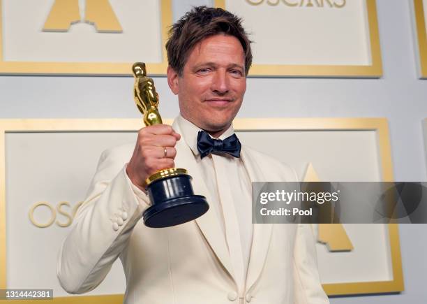 Thomas Vinterberg, winner of Best International Feature Film for "Another Round", poses in the press room during the Oscars on Sunday, April 25 at...