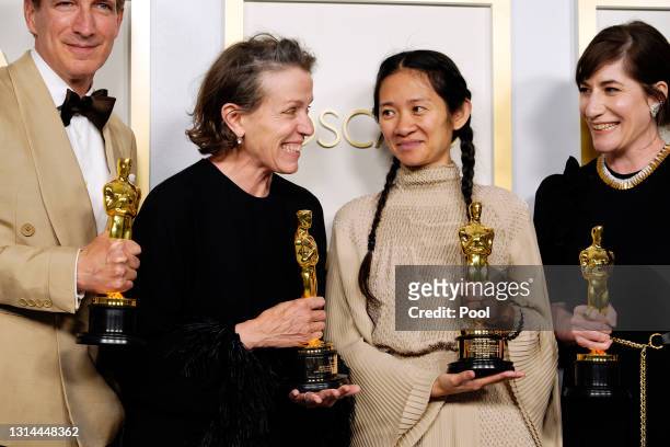 Peter Spears, Frances McDormand, Chloe Zhao and Mollye Asher, winners of Best Picture for "Nomadland," pose in the press room at the Oscars on...