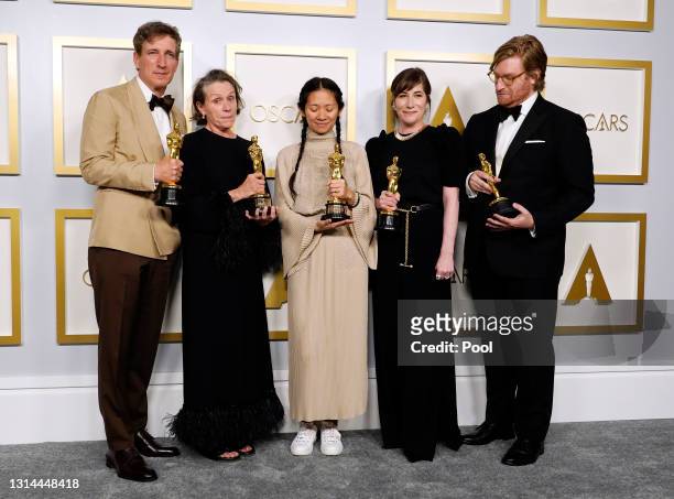 Peter Spears, Frances McDormand, Chloe Zhao, Mollye Asher, and Dan Janvey, winners of Best Picture for "Nomadland," pose in the press room at the...