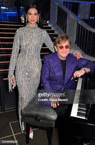 In this image released on April 25, Dua Lipa and Sir Elton John attend the 29th Annual Elton John AIDS Foundation Academy Awards Viewing Party on...