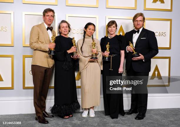 Peter Spears, Frances McDormand, Chloe Zhao, Mollye Asher, and Dan Janvey, winners of Best Picture for "Nomadland," pose in the press room at the...