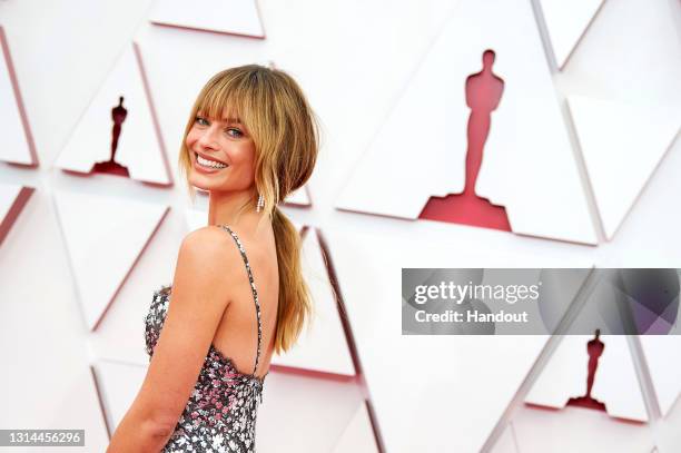 In this handout photo provided by A.M.P.A.S., Margot Robbie attends the 93rd Annual Academy Awards at Union Station on April 25, 2021 in Los Angeles,...