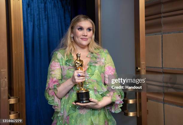 In this handout photo provided by A.M.P.A.S., Emerald Fennell poses backstage with the Oscar® for Original Screenplay during the 93rd Annual Academy...