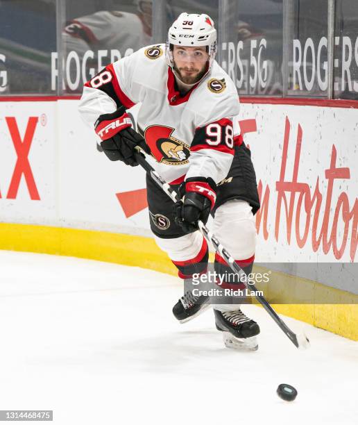 Victor Mete of the Ottawa Senators passes the puck during NHL action against the Vancouver Canucks at Rogers Arena on April 22, 2021 in Vancouver,...