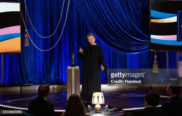 In this handout photo provided by A.M.P.A.S., Frances McDormand accepts the Oscar for Actress in a Leading Role for "Nomadland" the 93rd Annual...